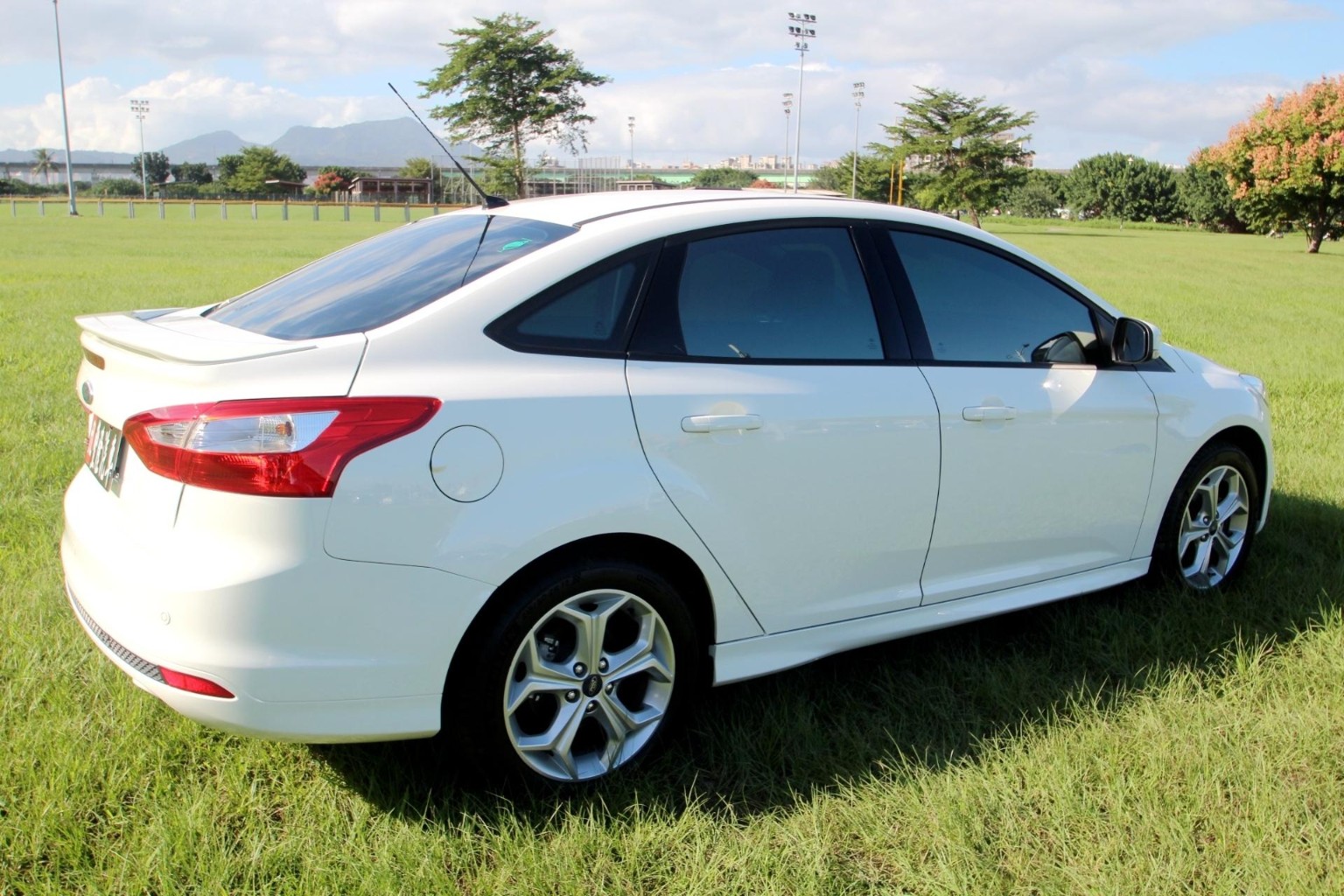 White Toyota sedan used for shuttle service