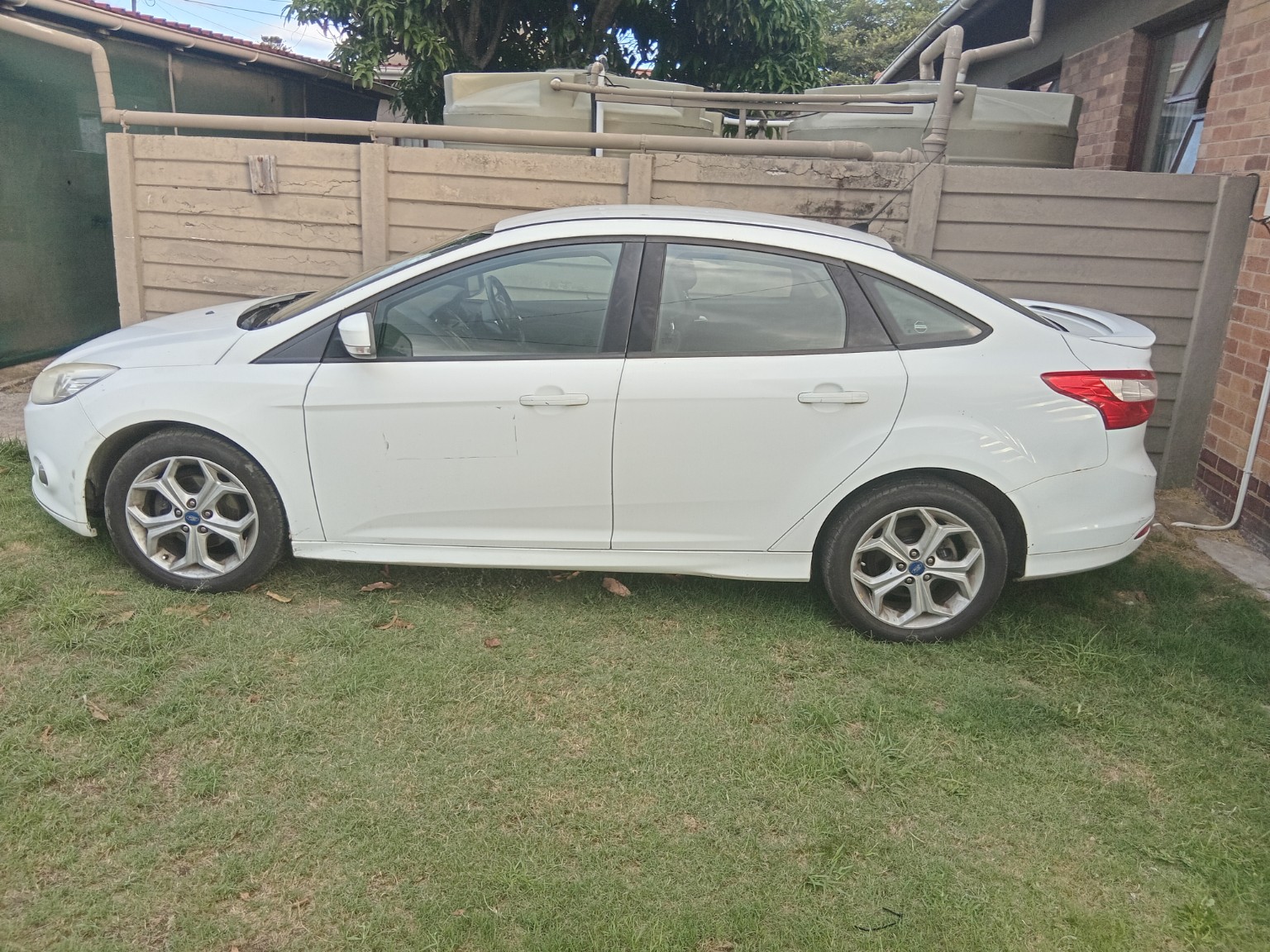 White sedan used for shuttle service